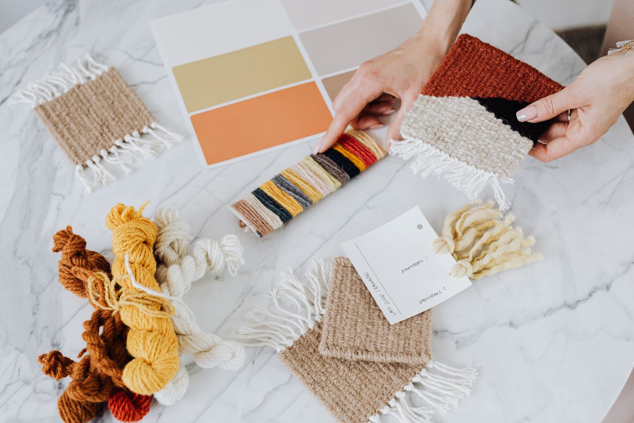 top-view-of-woman-holding-knitwork-decorations-4968582/