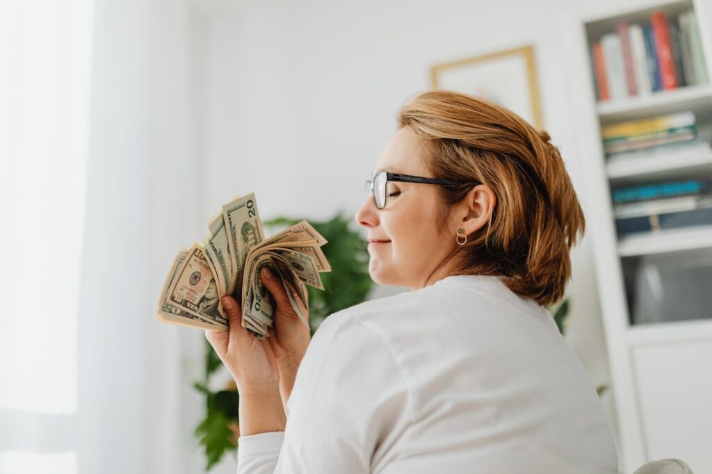a-woman-holding-money-