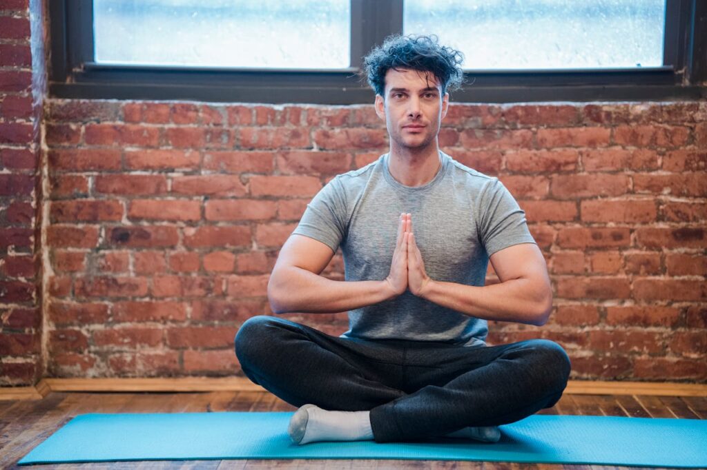 /young-man-meditating-in-easy-sit-position-