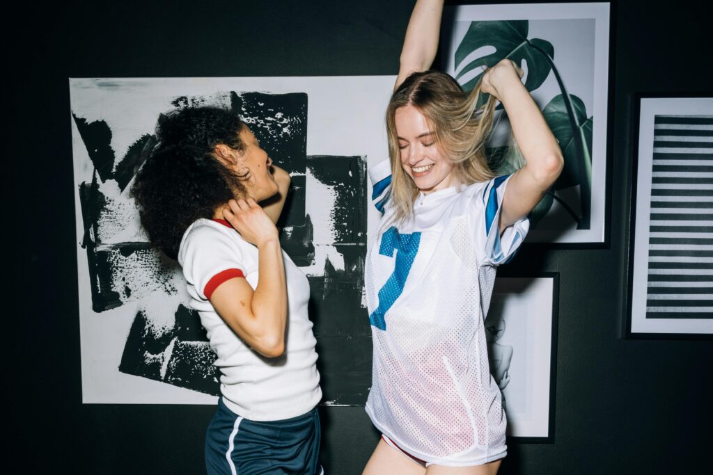 two-young-women-having-fun-dancing-