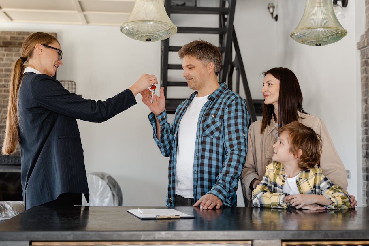 a-female-realtor-handing-over-the-key-