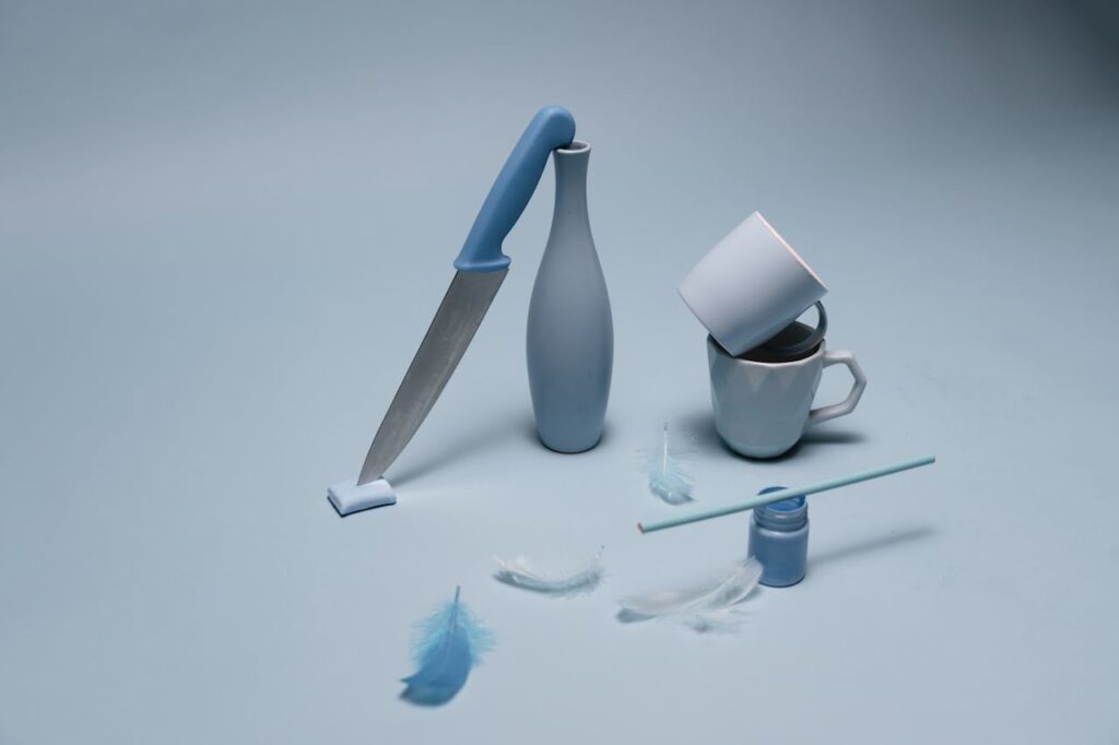 ceramics-cups-beside-a-knife-