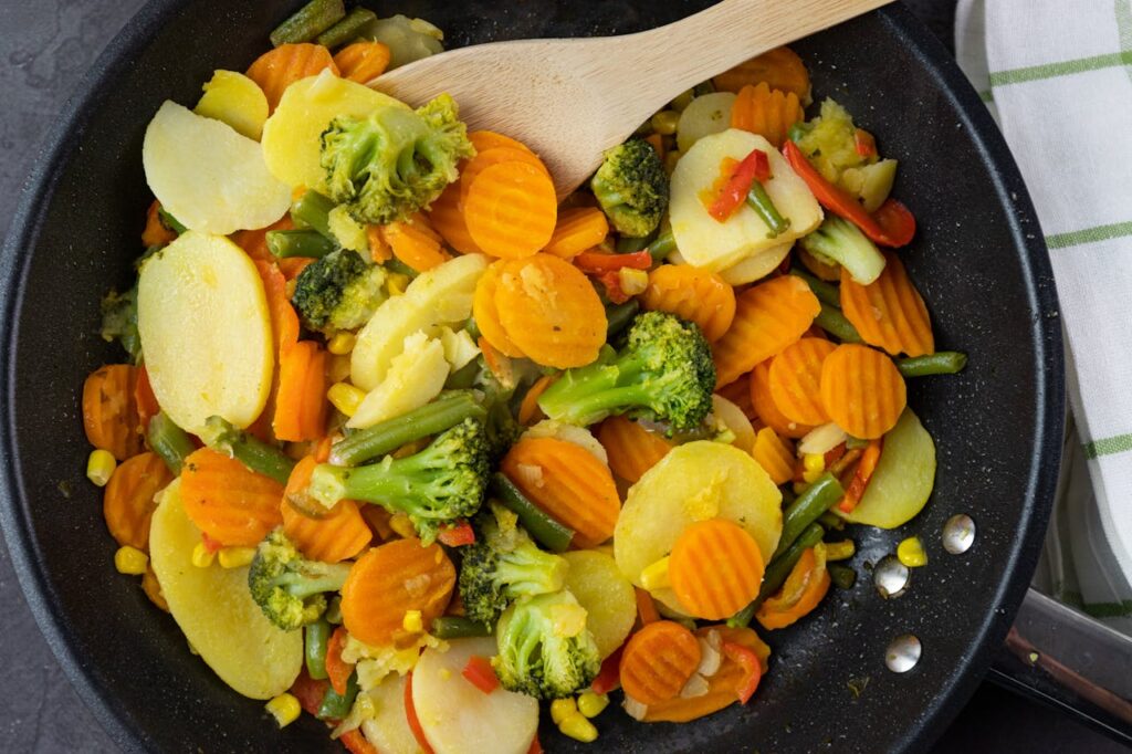 /close-up-shot-of-delicious-cooked-vegetables-on-frying-pan-
