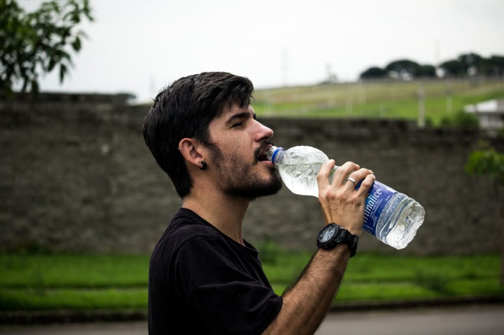 wearing-black-shirt-drinking-water-