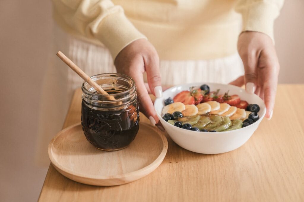 preparing-a-bowl-of-sliced-fruits-with-syrup-8
