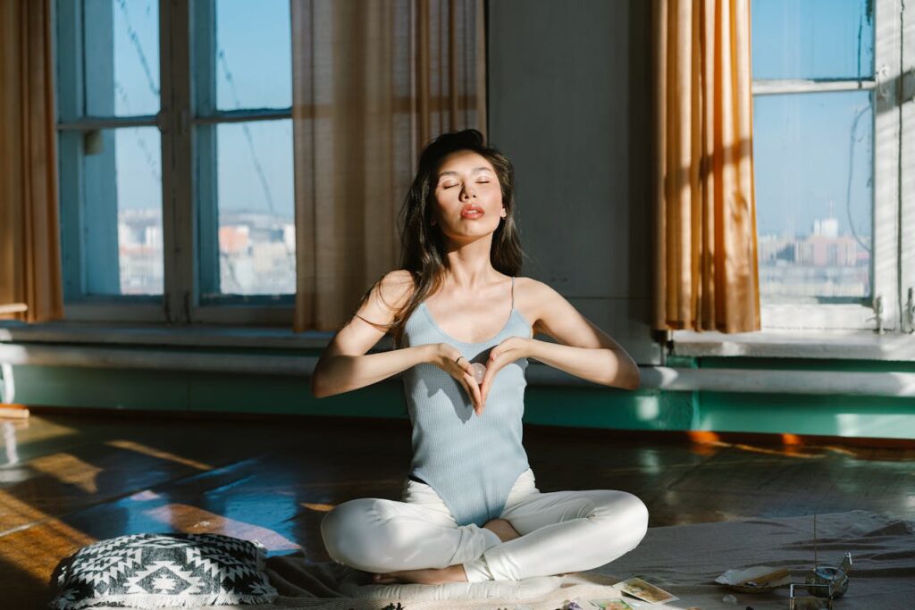 woman-with-stone-practicing-meditation-