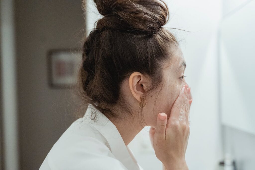 side-view-of-woman-washing-her-face