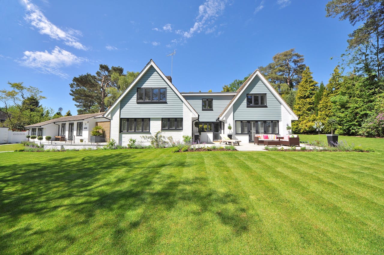 gray-wooden-house-near-grass-field-and-trees-28
