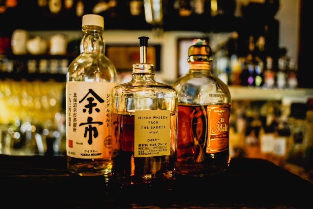 three-assorted-liquor-bottles-on-table-
