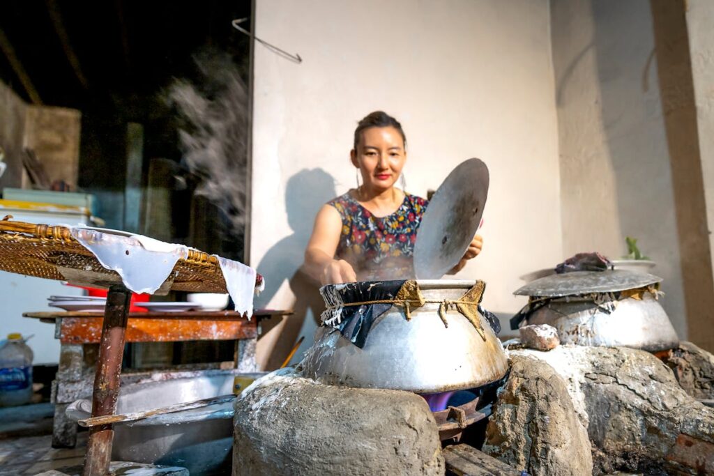/a-woman-cooking-outdoors-