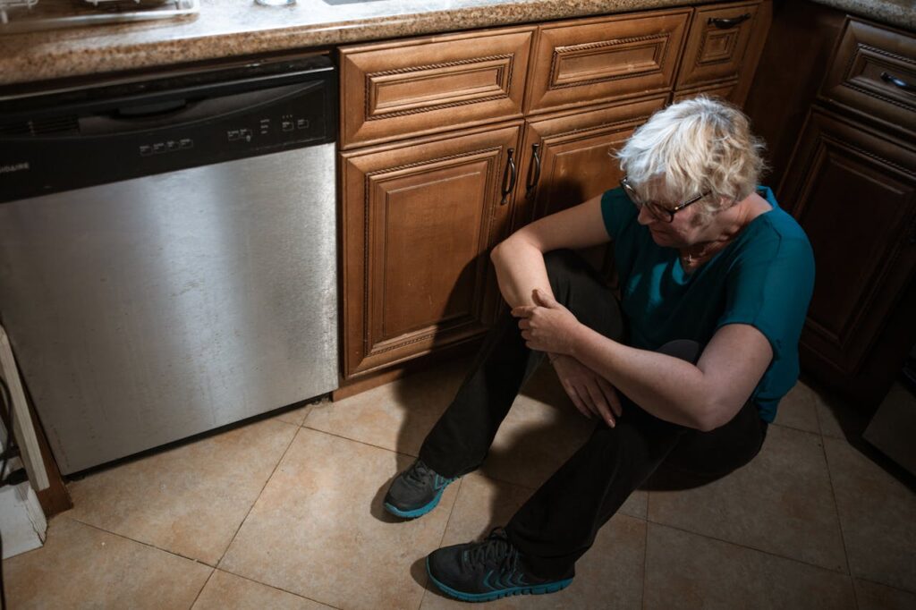 depressed-eldery-woman-seated-on-the-floor-