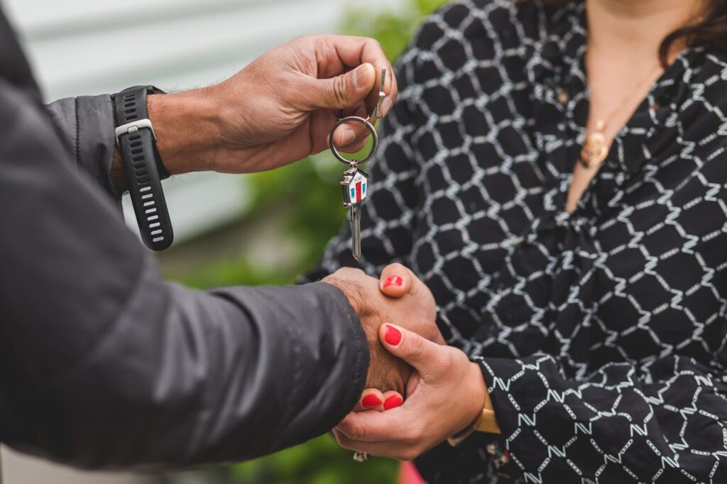 person-holding-a-silver-key-