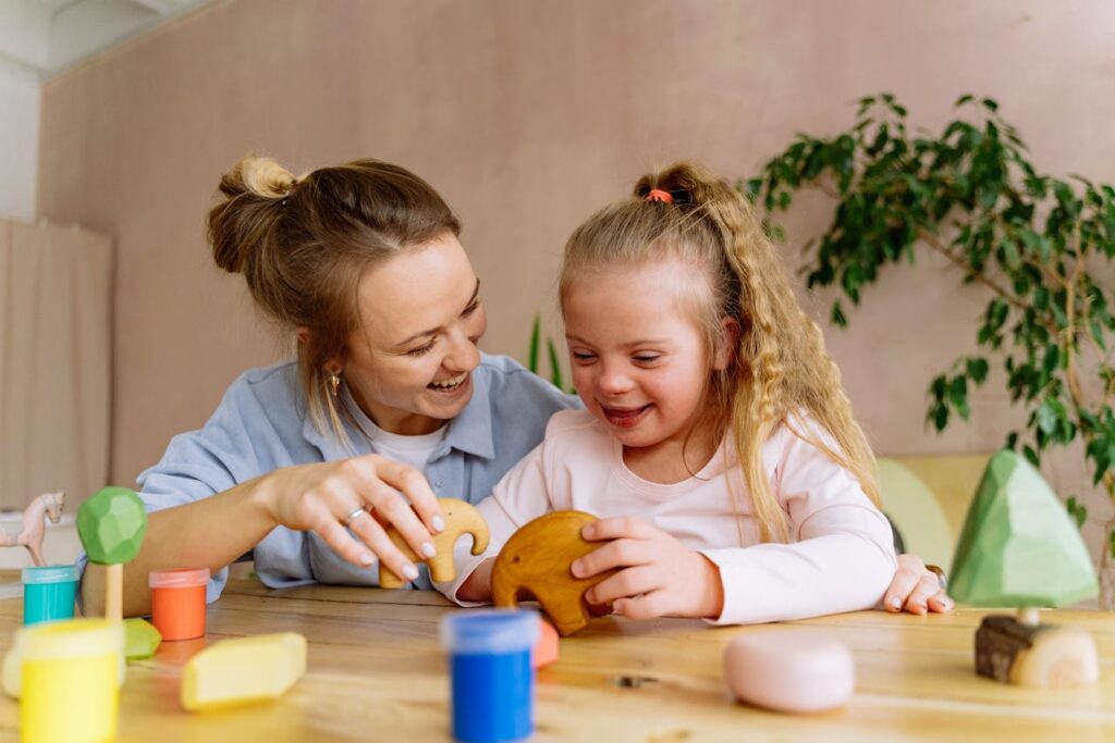 /woman-and-child-playing-with-wooden-toys-