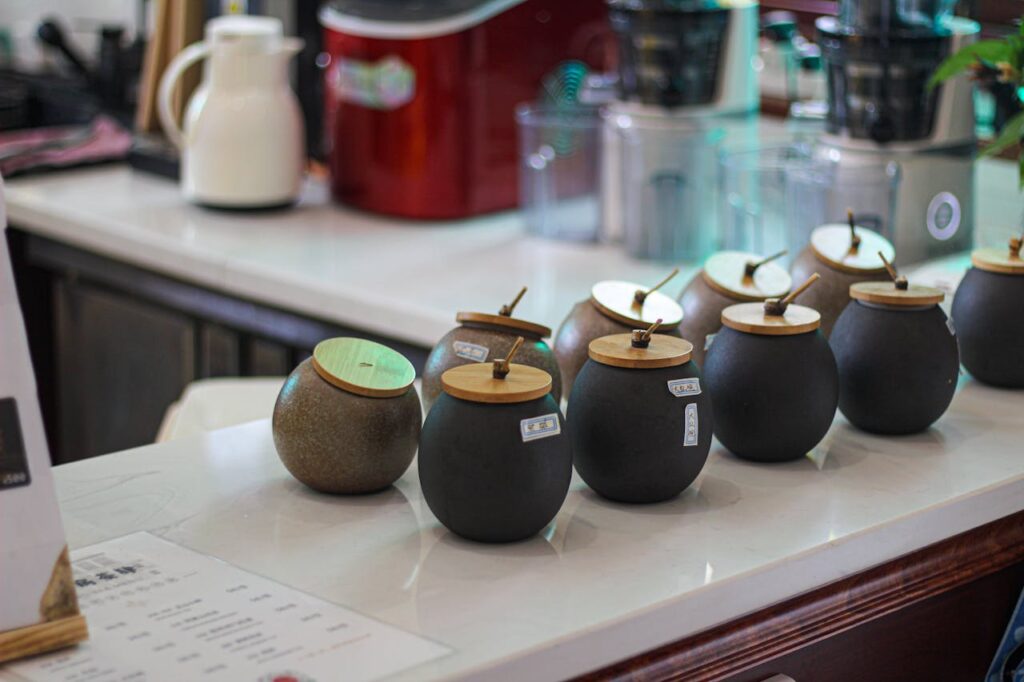 /black-round-jars-on-the-table-