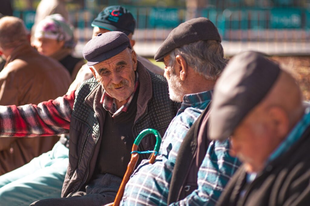 elderly-men-engaging-in-conversation-outdoors-
