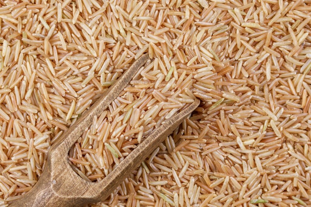 /rice-on-and-around-wooden-spoon