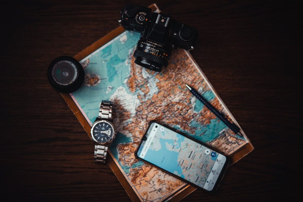 smartphone-beside-watch-and-camera