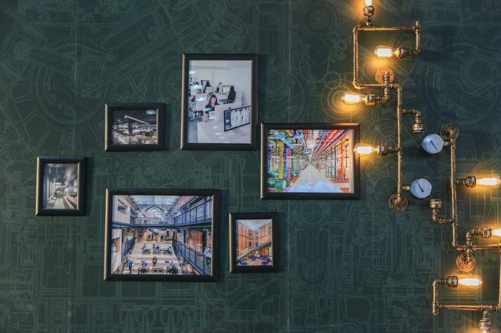 /assorted-paintings-on-green-wall-3