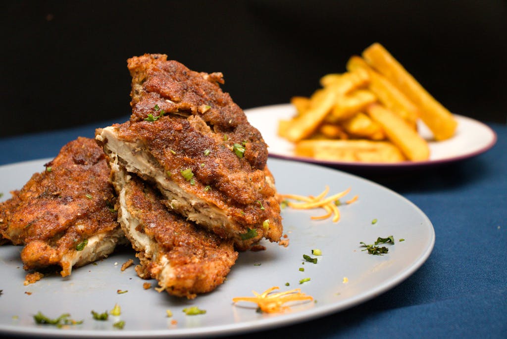 6 Foods That Are Quietly Killing You If You Have High Cholesterol 2 Savor the mouthwatering crispy chicken paired with seasoned fries, perfect for lunch or dinner.