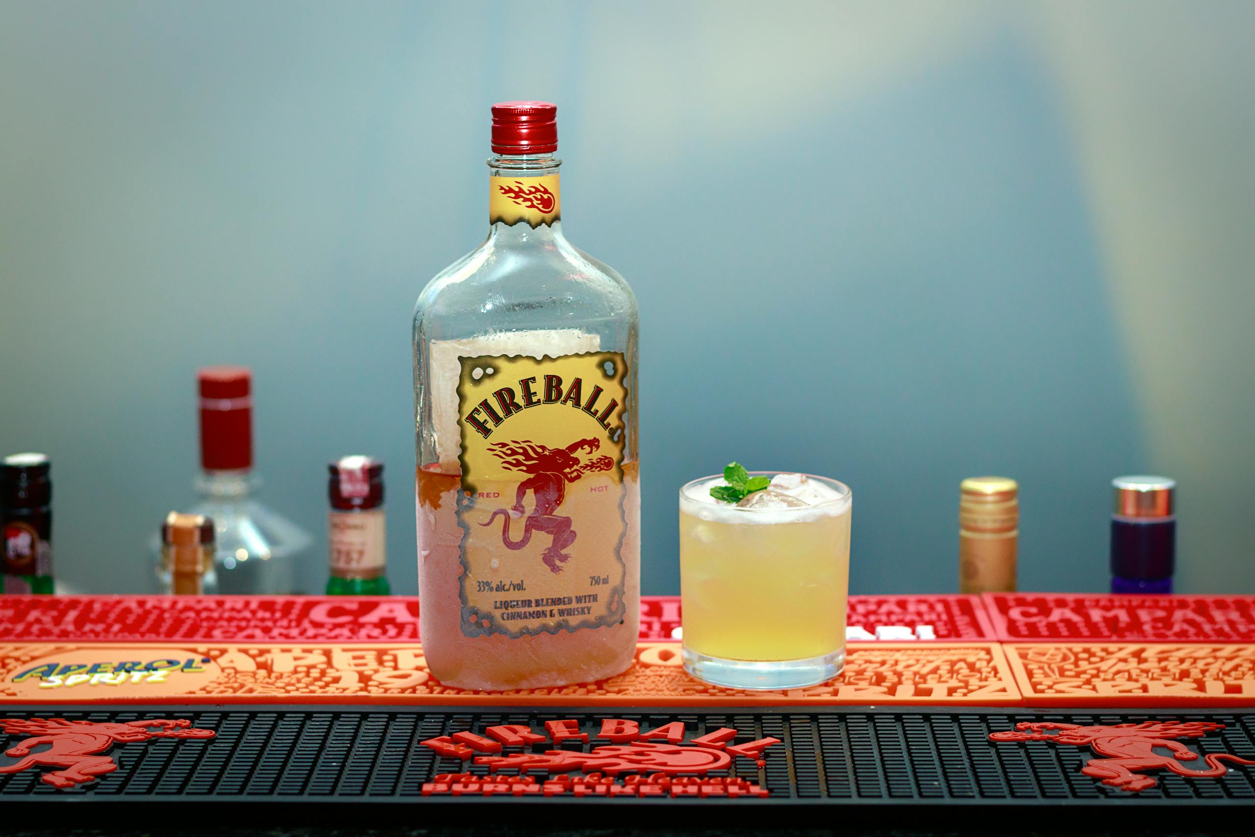 Still life of Fireball whiskey with cocktail on a bar counter in Recife, Brazil.
