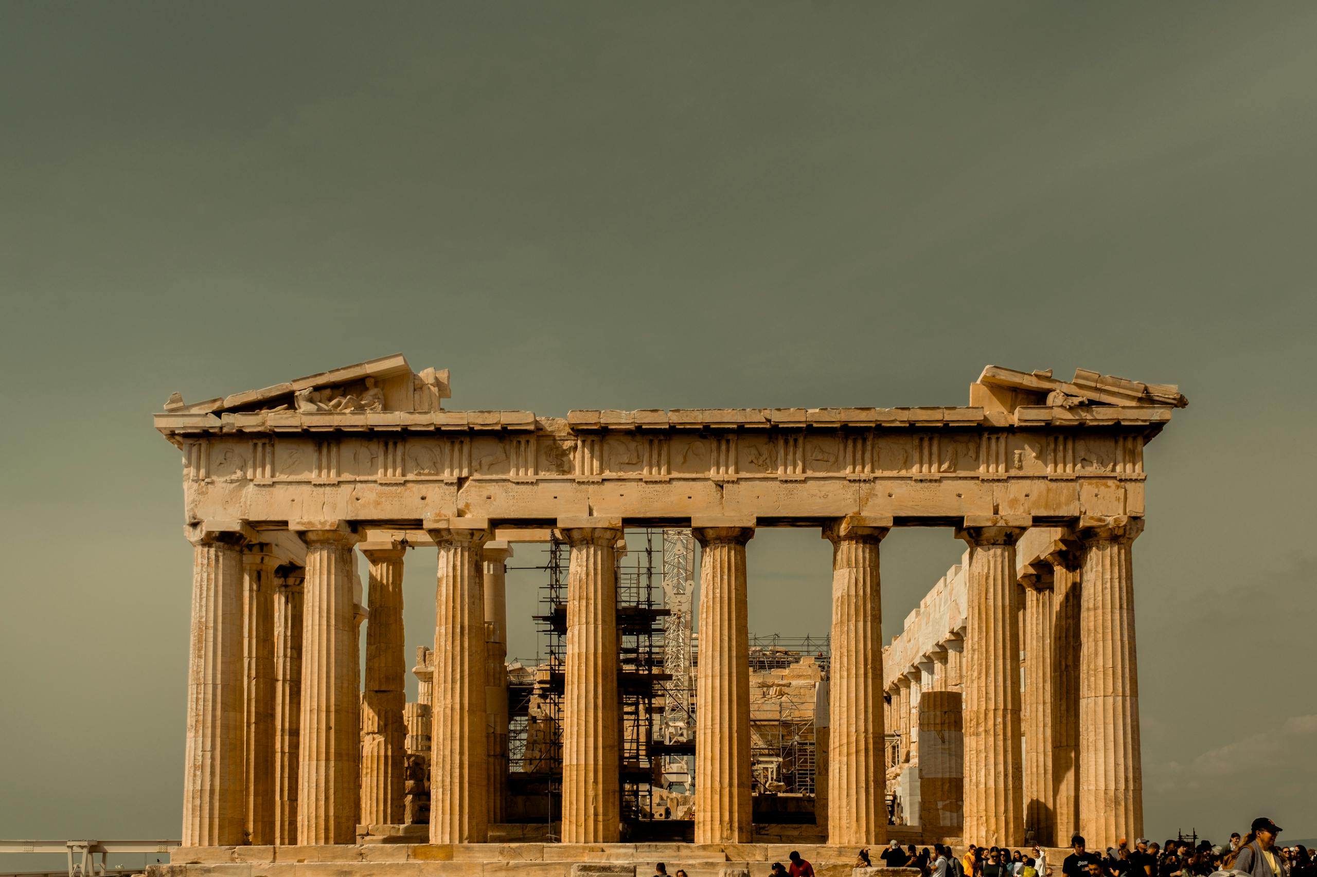 The iconic Parthenon temple bathed in warm light at the Acropolis of Athens, Greece.