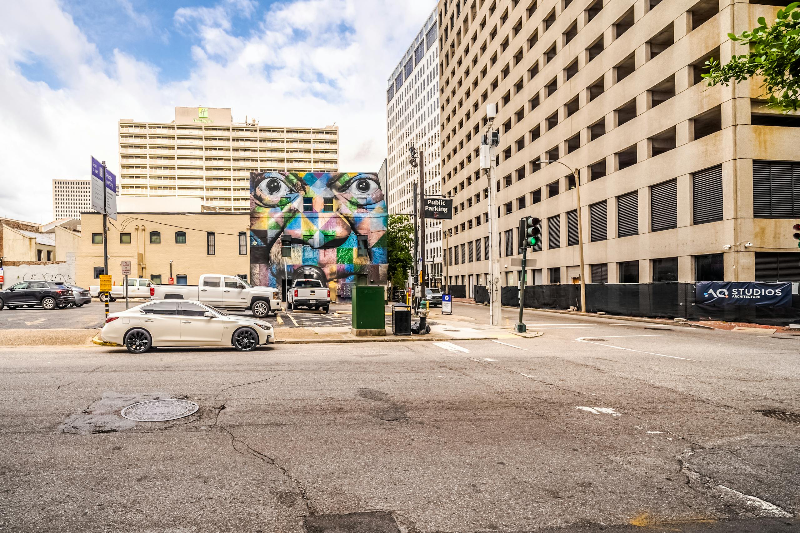 Vibrant street mural amidst urban architecture in downtown New Orleans.