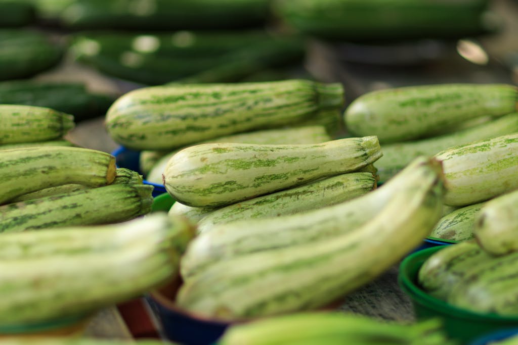 Vibrant zucchinis displayed in a market, showcasing fresh produce.