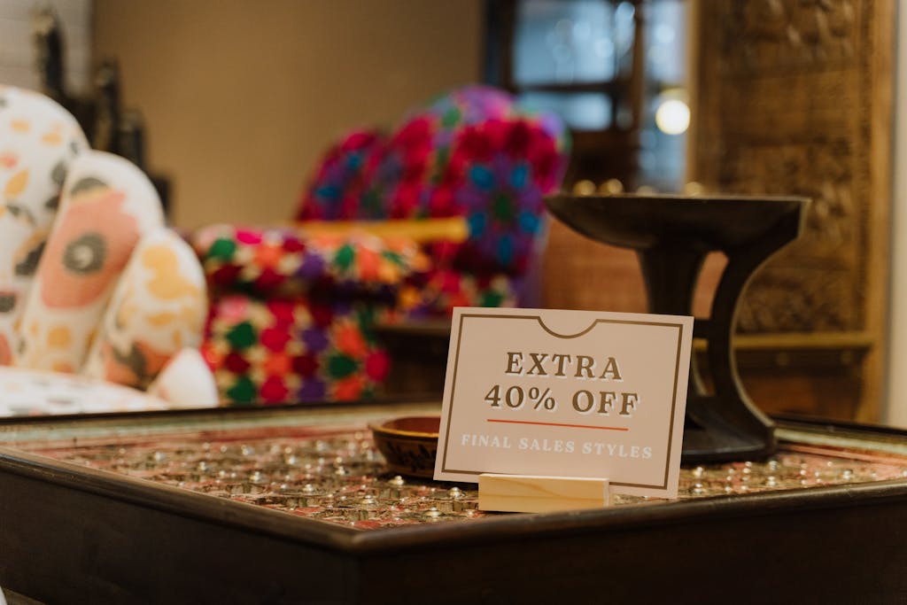 Warm store interior showcasing a discount sign offering extra 40% off on final sale styles.