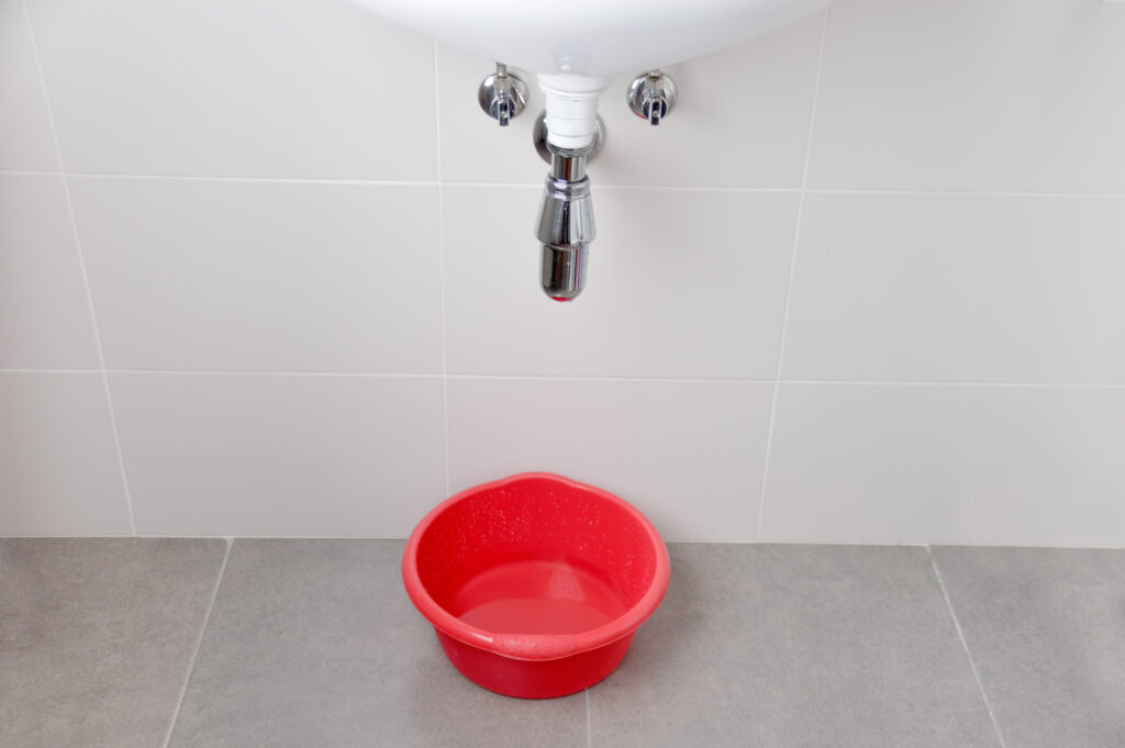 Water damage in home caused by due to clogged sanitary drain