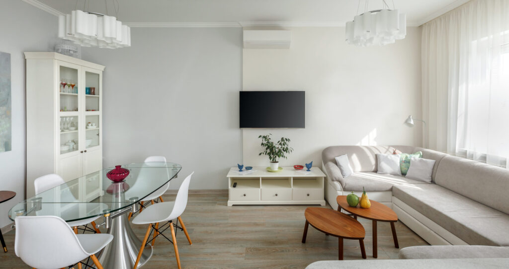 Trendy designed dining and living rooms in white lagom scandinavian style. Elegant contemporary loft apartment concept