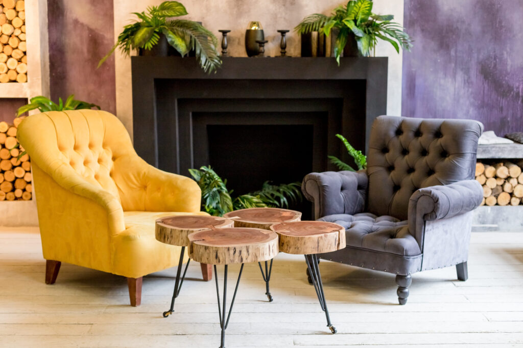 Modern luxury home and living room, fireplace and and armchairs.colorful wall decoration, wooden creative table. Living room corner style with fireplace decor and cozy interior room style.