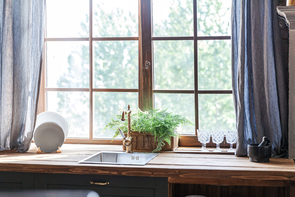 Scandinavian classic minimalistic dark gray kitchen with wooden details. Stylish loft modern gray kitchen decoration with clean contemporary style interior design
