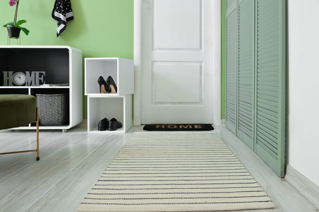 Stylish rug in interior of modern hallway