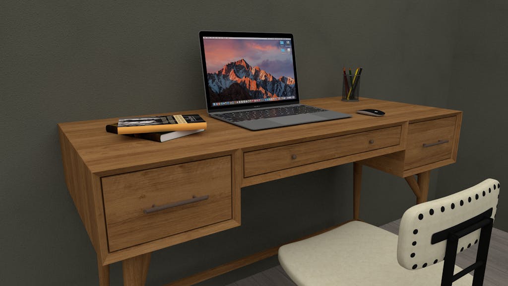 Cozy workspace featuring a wooden desk with a laptop and chair.