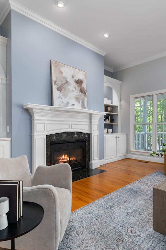 Modern living room showcasing a stylish fireplace and elegant décor creating inviting ambiance.