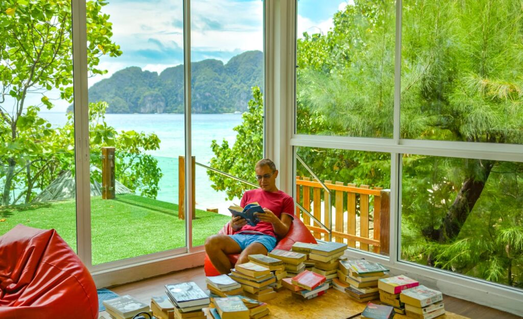 relaxed-reading-by-scenic-seaside-window-