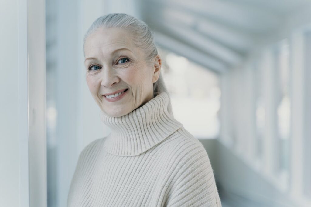 smiling-woman-in-turtleneck-sweater-