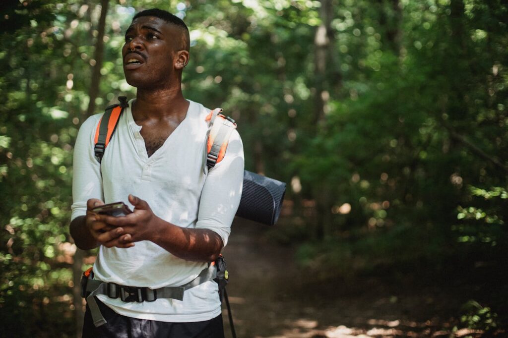 black-man-got-lost-with-smartphone-in-forest-