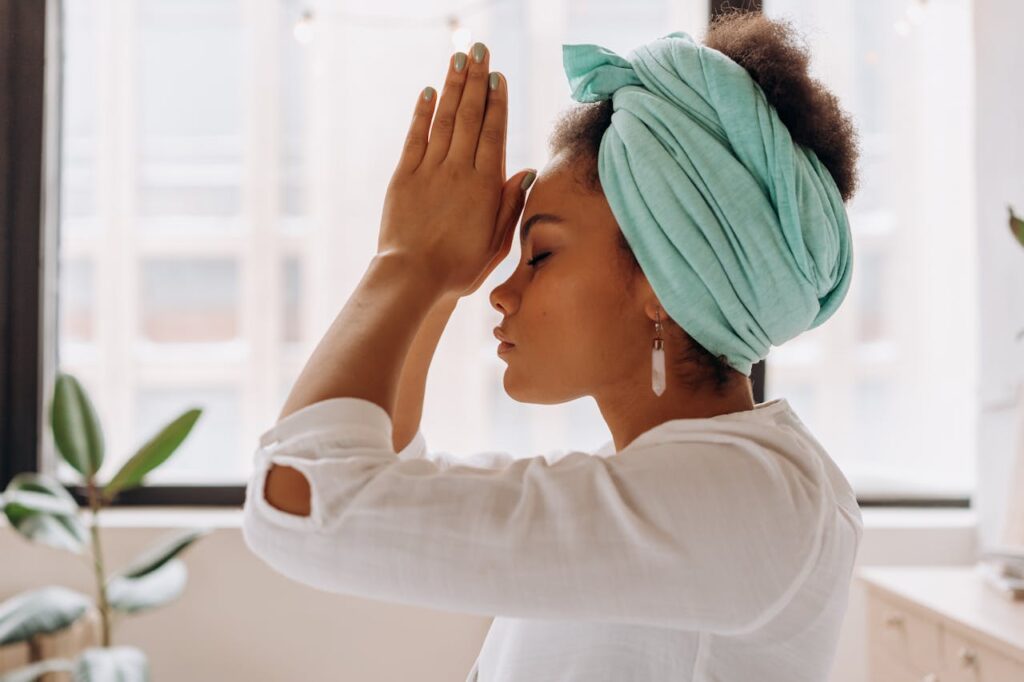 woman-in-white-long-sleeve-shirt-with-blue-towel-on-head