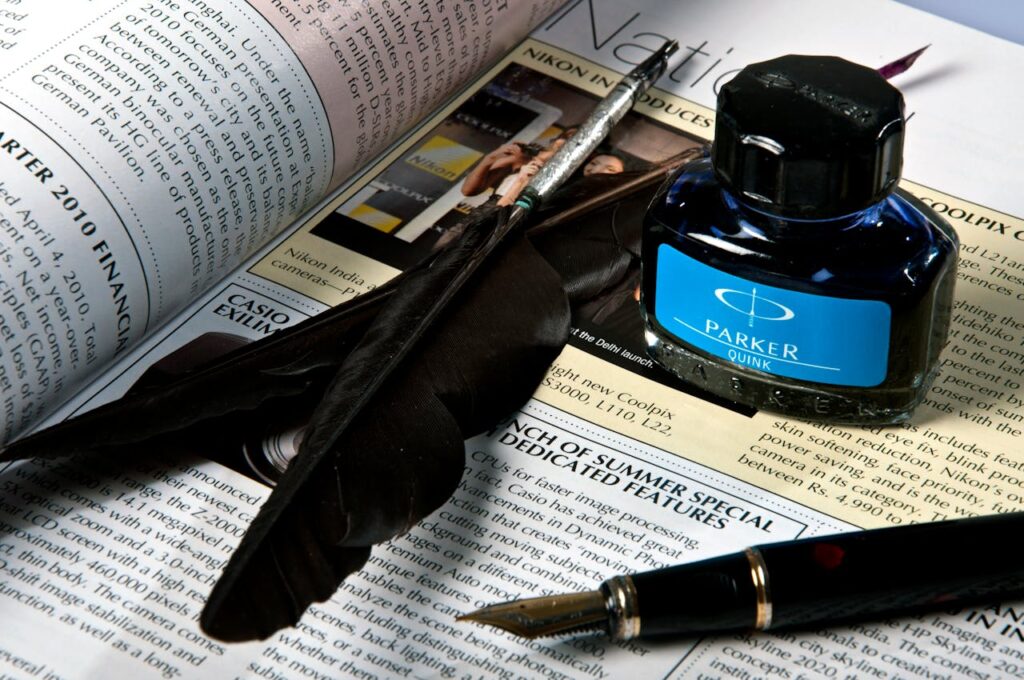 ink-feather-on-a-newspaper-