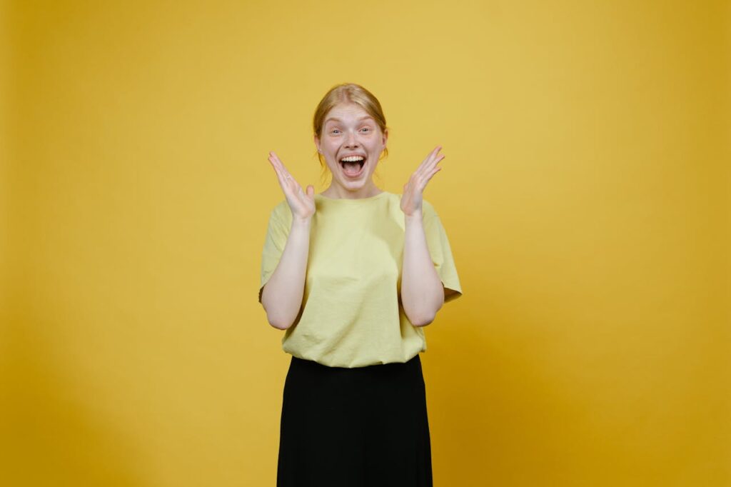woman-in-yellow-shirt-smiling-