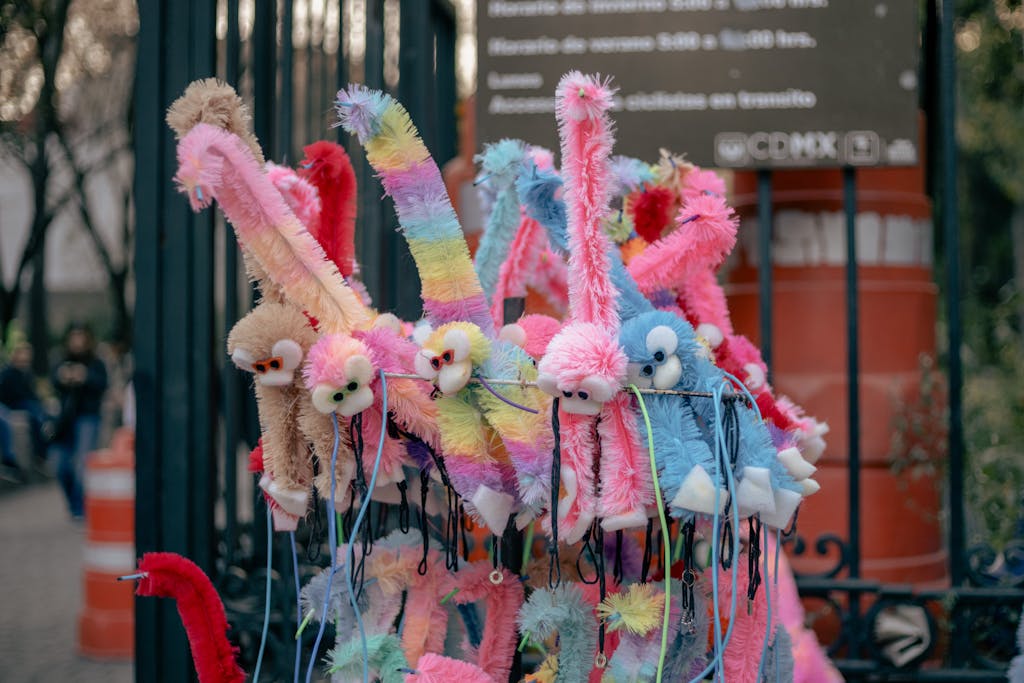 A vibrant display of plush animal toys at an outdoor stall in Mexico City.