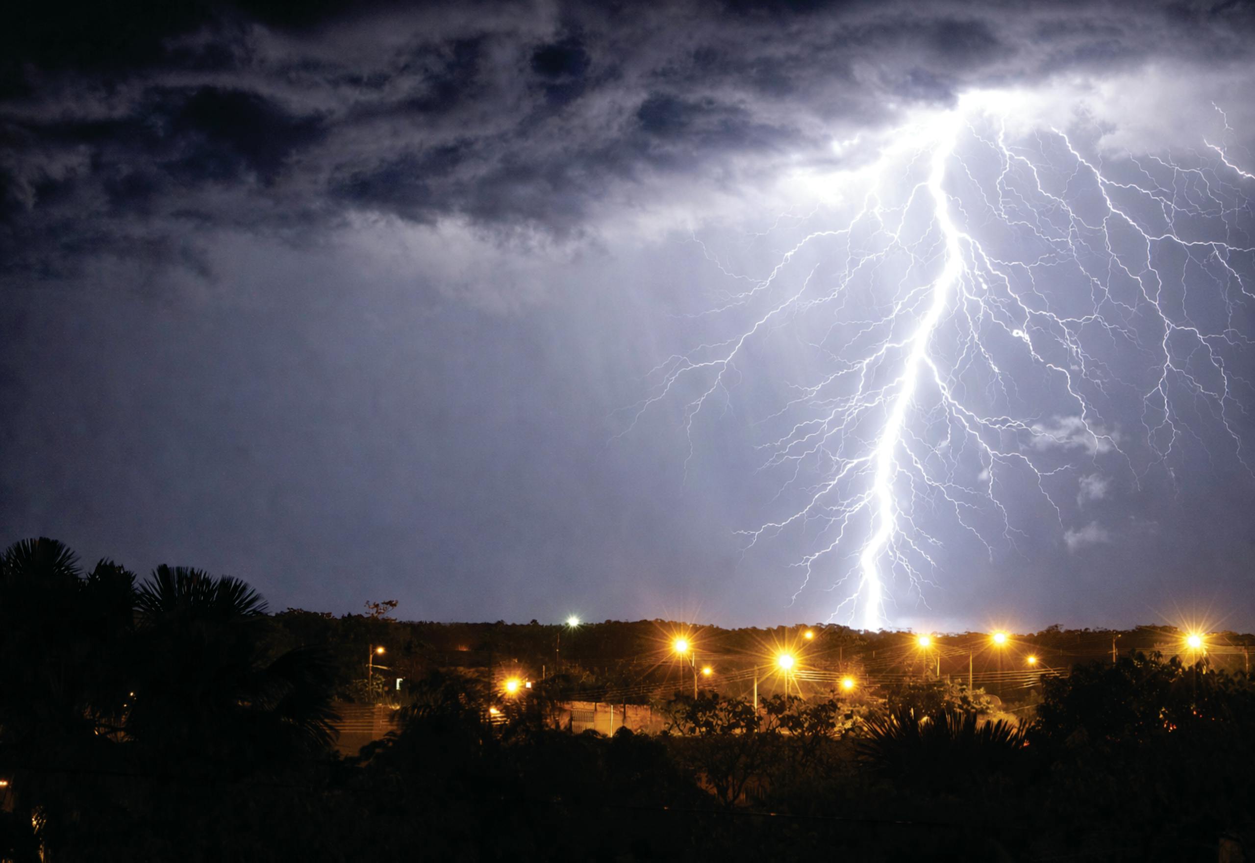 A vivid lightning strike illuminates the night sky over Palmas, Tocantins, Brazil.