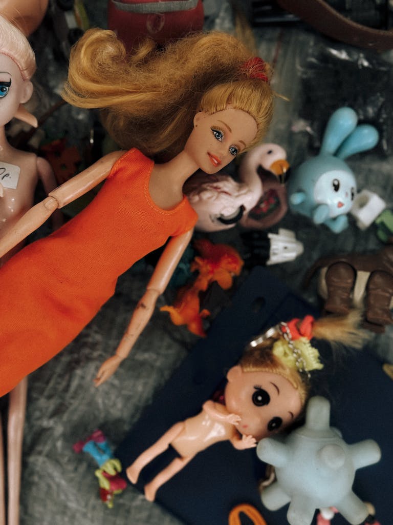An eclectic mix of dolls and toys, highlighting vibrant colors and childhood memories.
