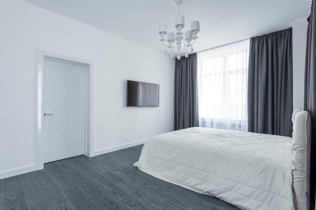 Bright modern bedroom with minimalist decor and elegant design.