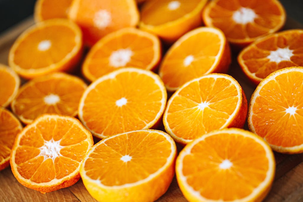 Close-up of freshly sliced oranges showcasing vibrant, juicy texture. Perfect for healthy lifestyle concepts.
