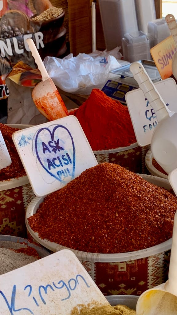 Colorful spices on display in a bustling Turkish market, capturing aromatic charm.