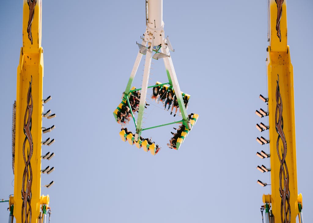 Exciting ride at an amusement park with people enjoying the thrill.