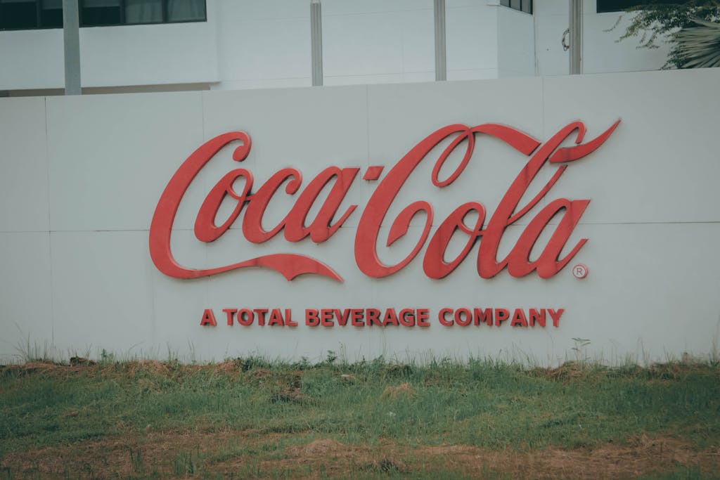 Image of Coca-Cola logo on outdoor signage, showing brand identity.