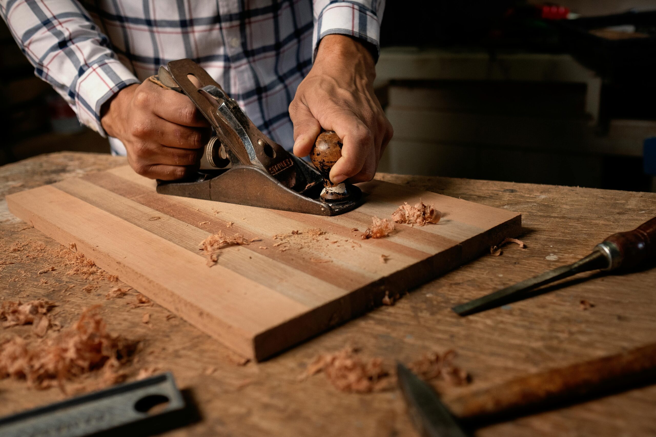 a-person-using-a-wood-planer